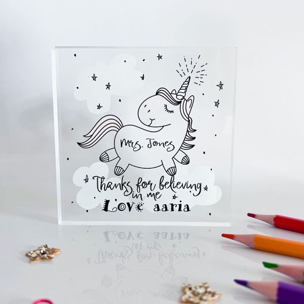 a picture of a personalised teacher unicorn design acrylic block